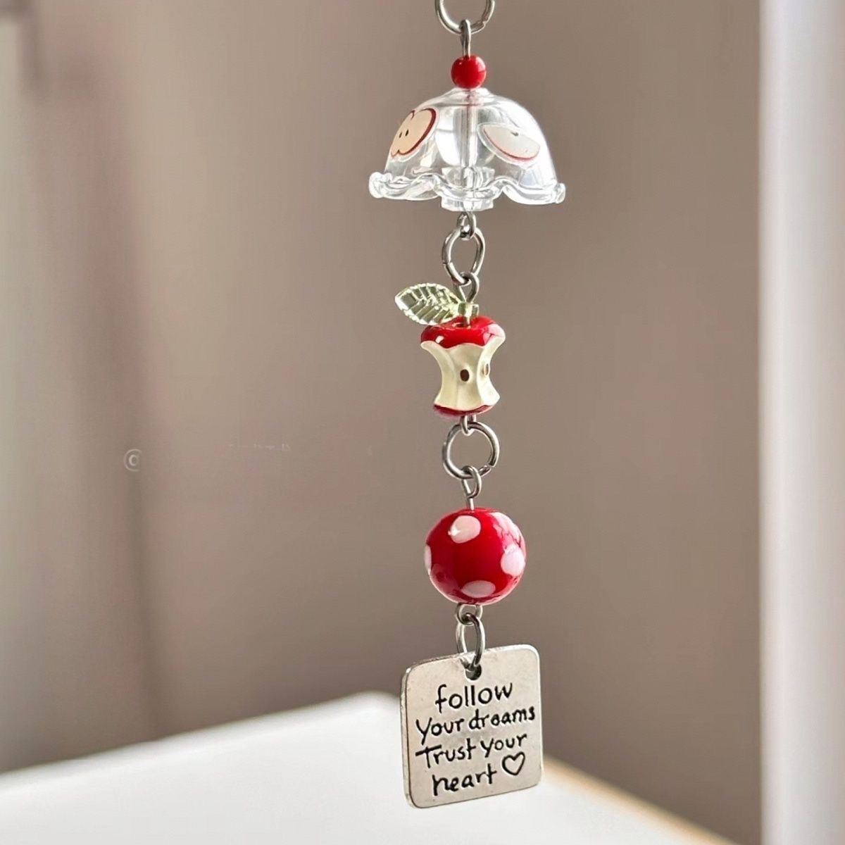 Red Apple Core Wind Chime Pendant Bring natural charm to your space with this delicate red apple core wind chime pendant