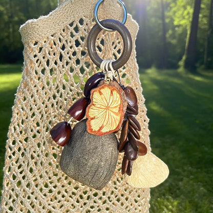 Forest-Inspired Handmade Nutshell Wind Chime Bag Charm Bring natural elegance to your everyday carry with this enchanting handmade bag charm