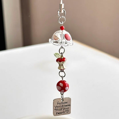 Red Apple Core Wind Chime Pendant Bring natural charm to your space with this delicate red apple core wind chime pendant