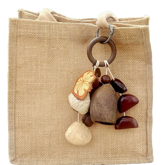 Forest-Inspired Handmade Nutshell Wind Chime Bag Charm Bring natural elegance to your everyday carry with this enchanting handmade bag charm