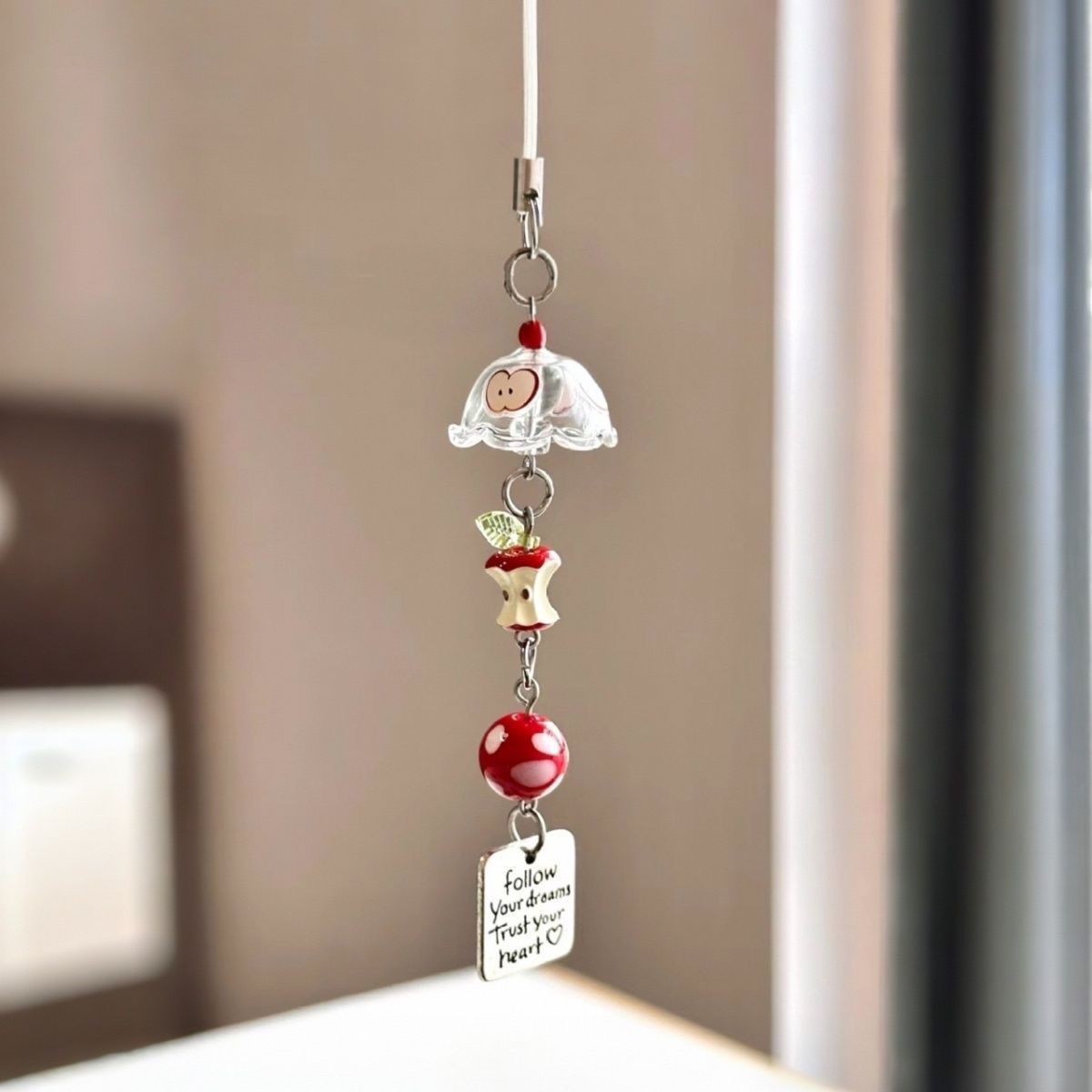 Red Apple Core Wind Chime Pendant Bring natural charm to your space with this delicate red apple core wind chime pendant