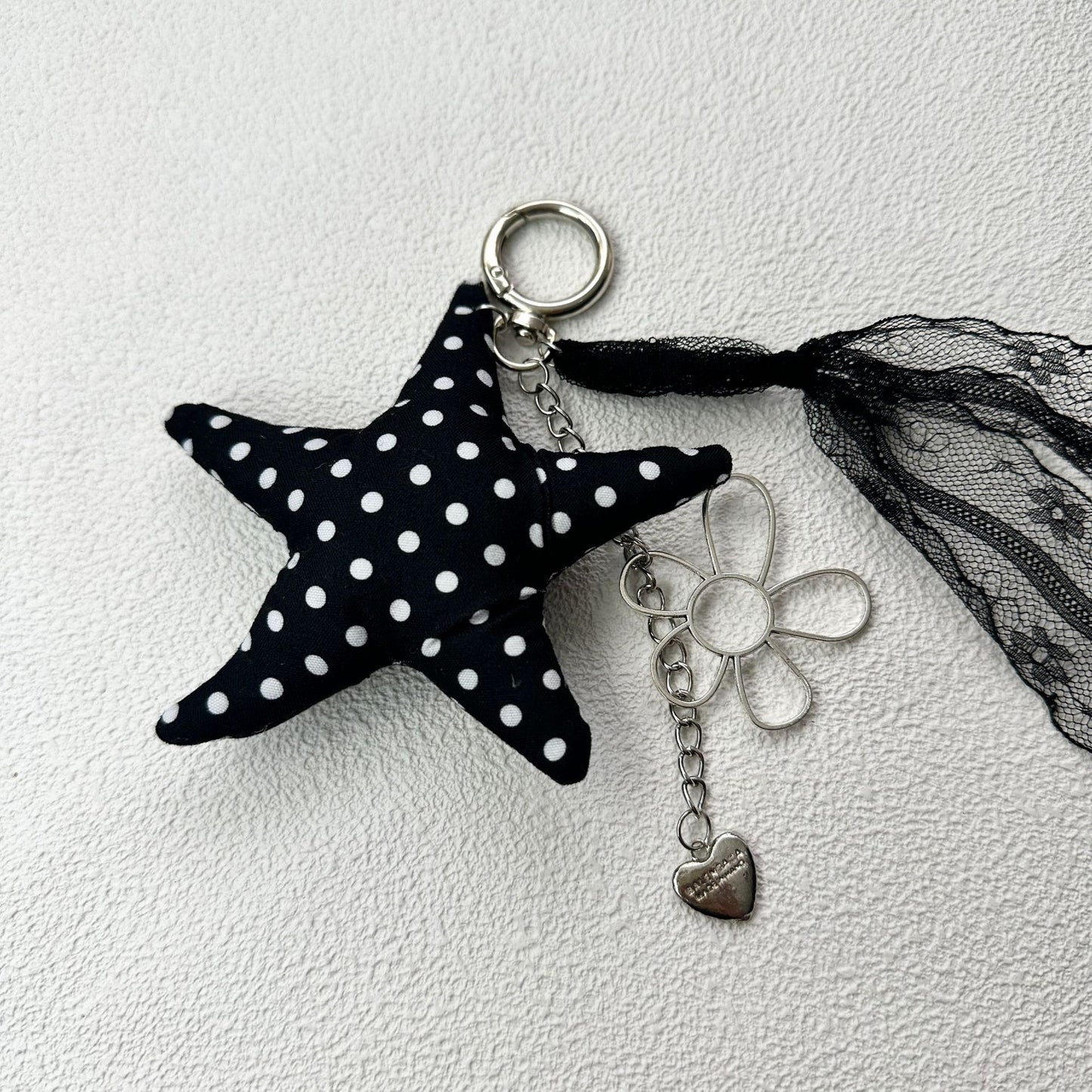 Vintage Canvas Bag Charm with Five-Pointed Star.Add a touch of retro charm to your everyday carry with this stylish fabric bag accessory