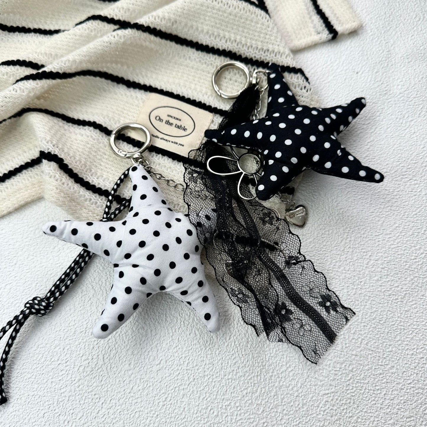 Vintage Canvas Bag Charm with Five-Pointed Star.Add a touch of retro charm to your everyday carry with this stylish fabric bag accessory