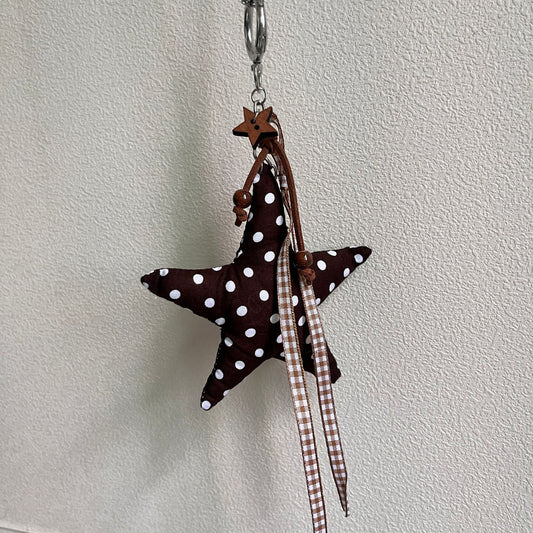 Vintage Canvas Bag Charm with Five-Pointed Star.Add a touch of retro charm to your everyday carry with this stylish fabric bag accessory